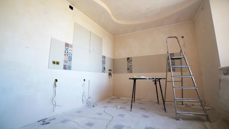 Renovation work underway inside a rental property, where the repair versus capital improvement distinction decides the deduction